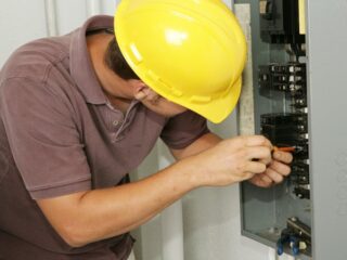 depositphotos_6685695-stock-photo-electrician-breaker-panel-1