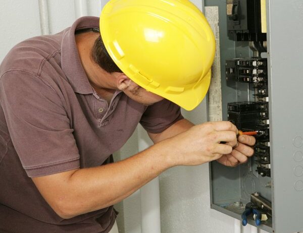 depositphotos_6685695-stock-photo-electrician-breaker-panel-2