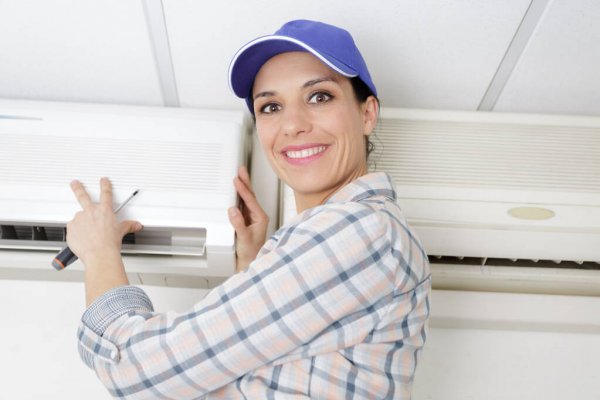 depositphotos_317337994-stock-photo-woman-using-screwdriver-on-appliance